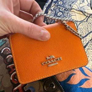 Coach wallet with long chain.